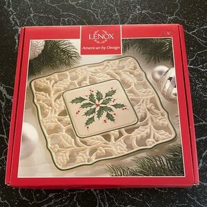 Brand new in box. Lenox pierced trivet 7.5 inches with Holly print.